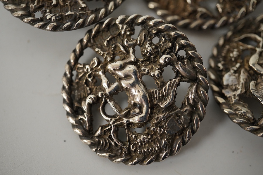 A set of 5 late Victorian cast silver buttons, decorated with Cupid drawing his bow, L.H., London 1900, 33mm. Condition - good
